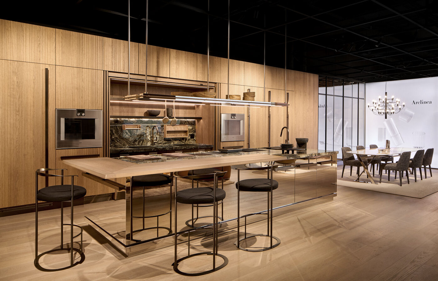 Arclinea Proxima kitchen with wood cabinetry, marble island and integrated appliances