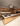 Arclinea Proxima kitchen with bronze pvd island and suspended hood