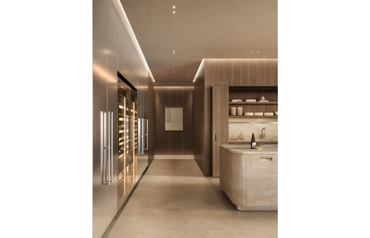 kora kitchen with travertine island and integrated handle, stainless steel wine storage units and oak cabinetry with recessed workspace