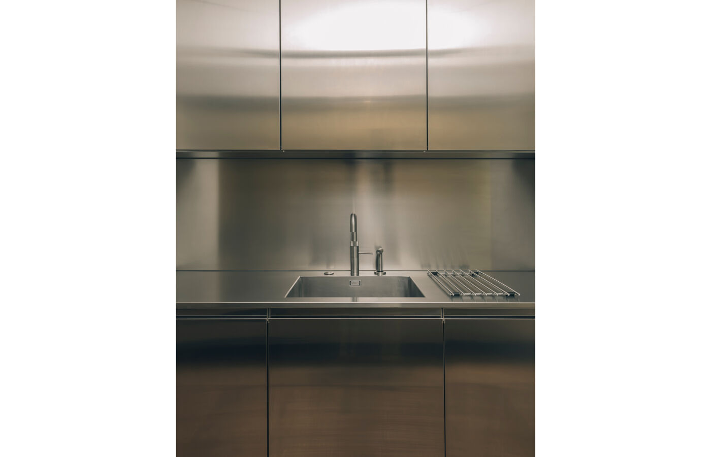 sink detail of stainless steel Convivium Arclinea luxury kitchen in London, at home Rebecca Willer