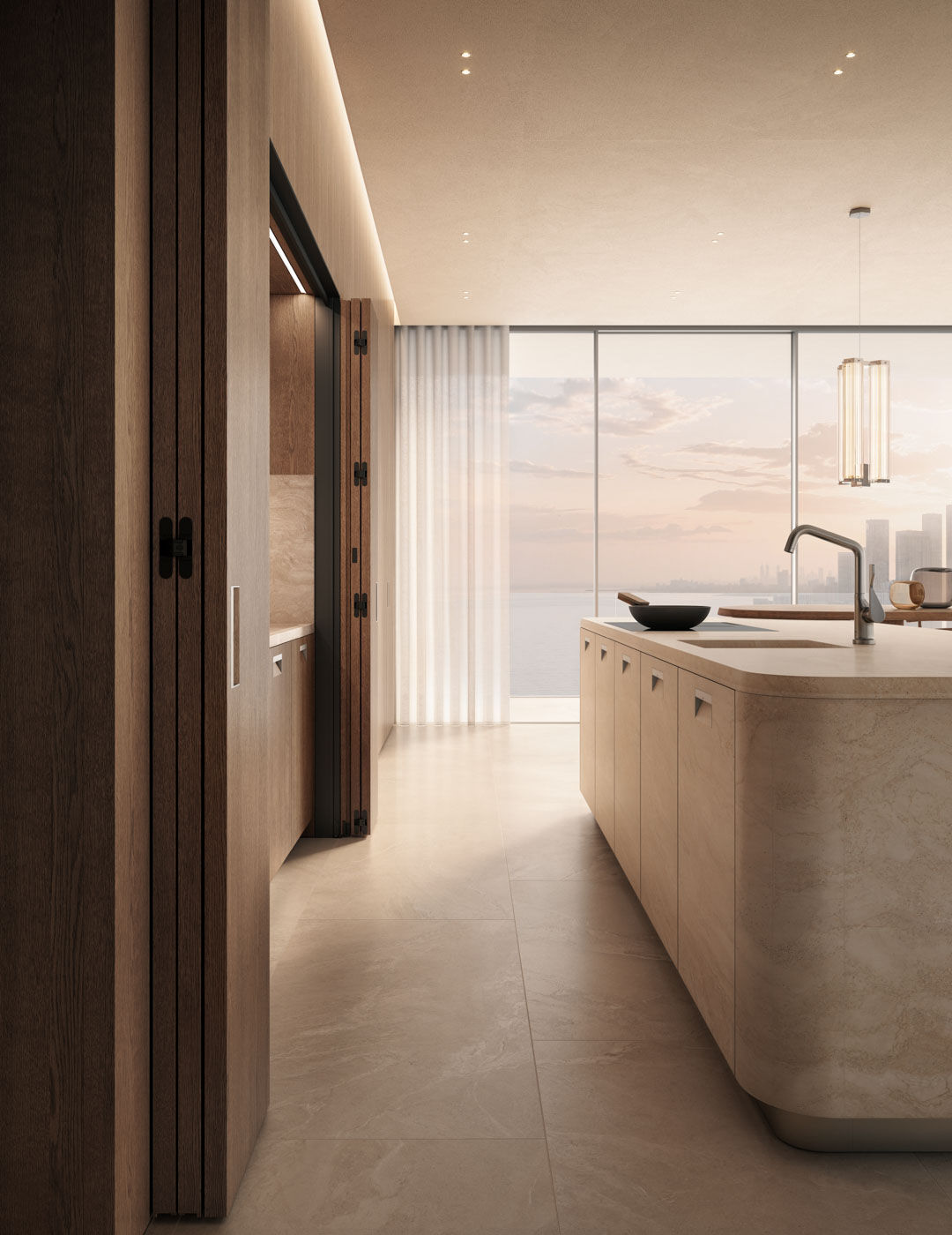 kora kitchen with travertine island and integrated sink, oak cabinetry with folding doors and panoramic window view