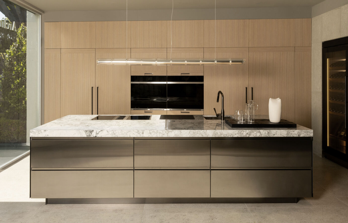 Arclinea Convivium kitchen with pvd plus black island and brushed oak cabinetry