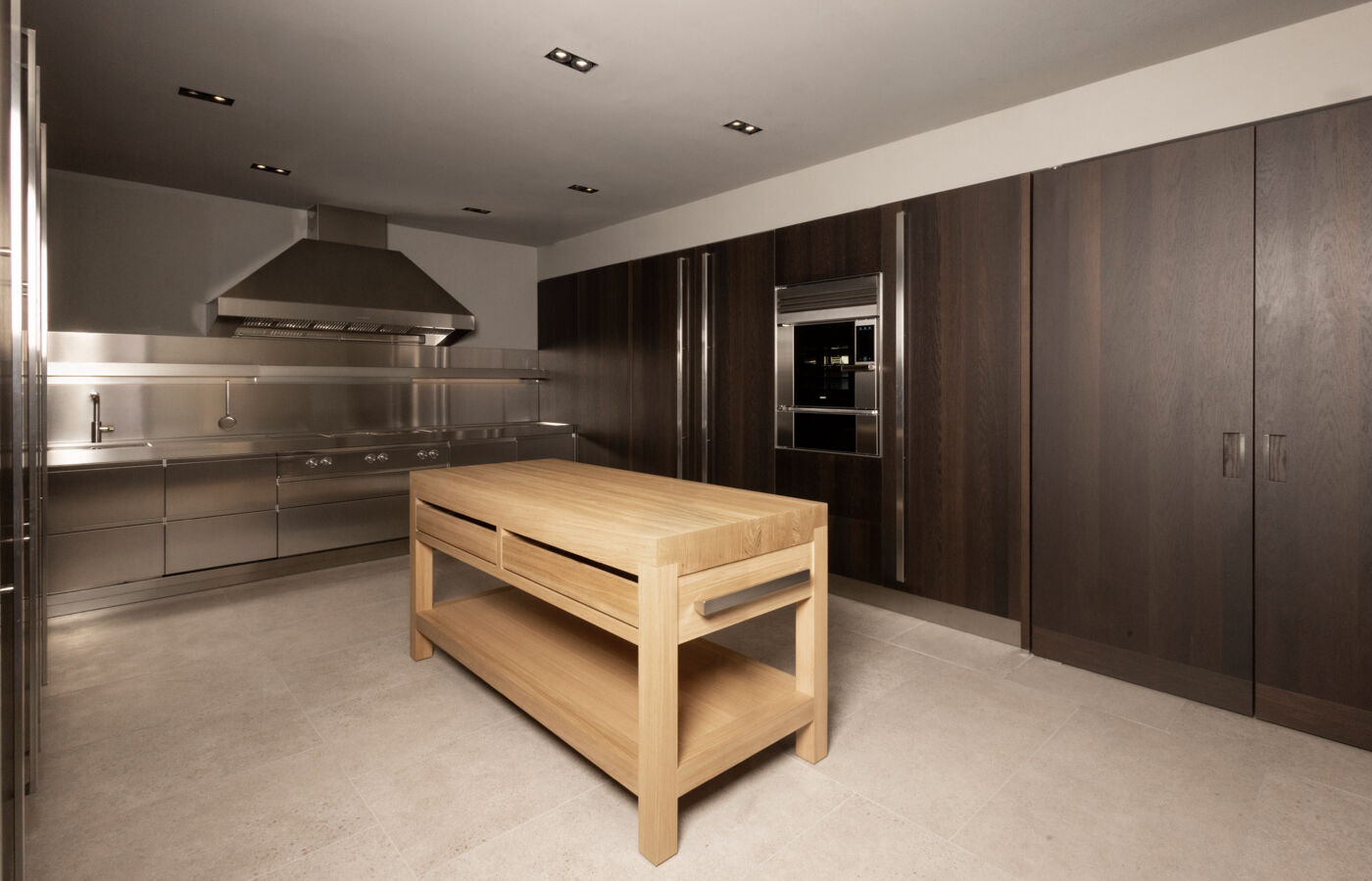 Arclinea Proxima kitchen with stainless steel workspace and solid wood butcher